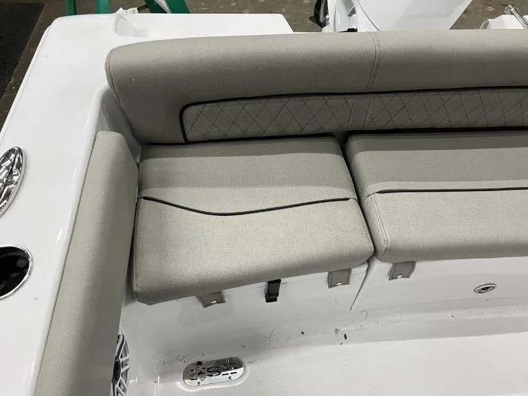 Slide: The Image of 2023 Sportsman 211 Heritage boat seating with cushioned backrest and storage. - 16