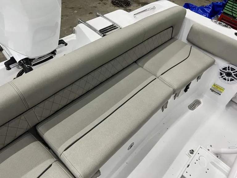 Slide: The Image of 2023 Sportsman 211 Heritage boat with cushioned seating and integrated speaker system. - 17