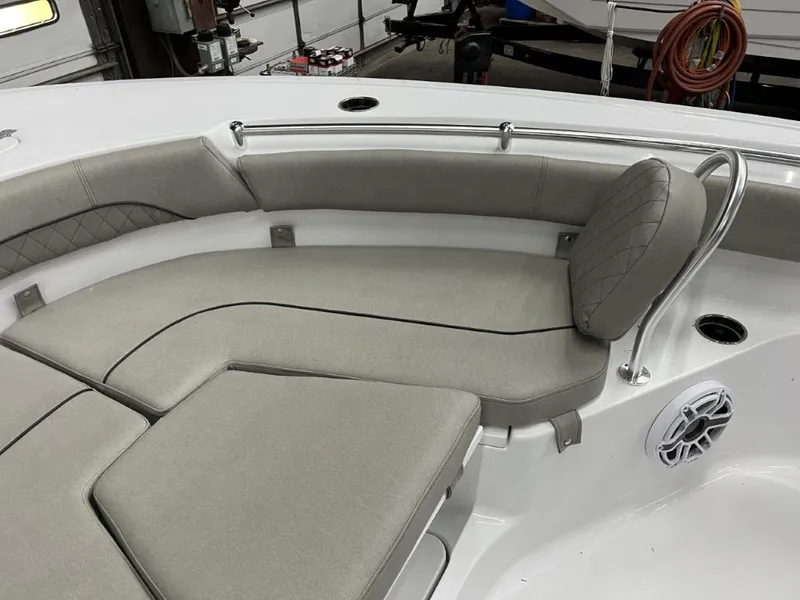 Slide: The Image of 2023 Sportsman 211 Heritage boat interior with cushioned seating and stainless steel rail. - 20