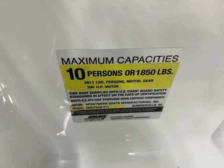 Slide: The Image of 2023 Sportsman 211 Heritage boat capacity label: 10 persons or 1850 lbs, 200 HP motor. - 24