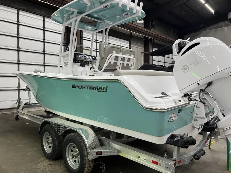 Slide: The Image of 2023 Sportsman 211 Heritage boat on trailer in warehouse. - 5