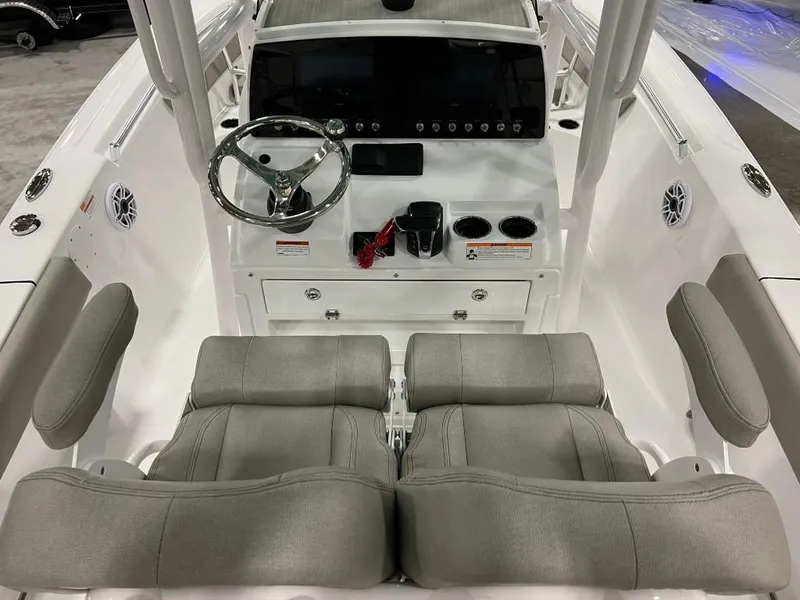 Slide: The Image of 2023 Sportsman 211 Heritage boat interior with dual seats, steering wheel, and control panel. - 8