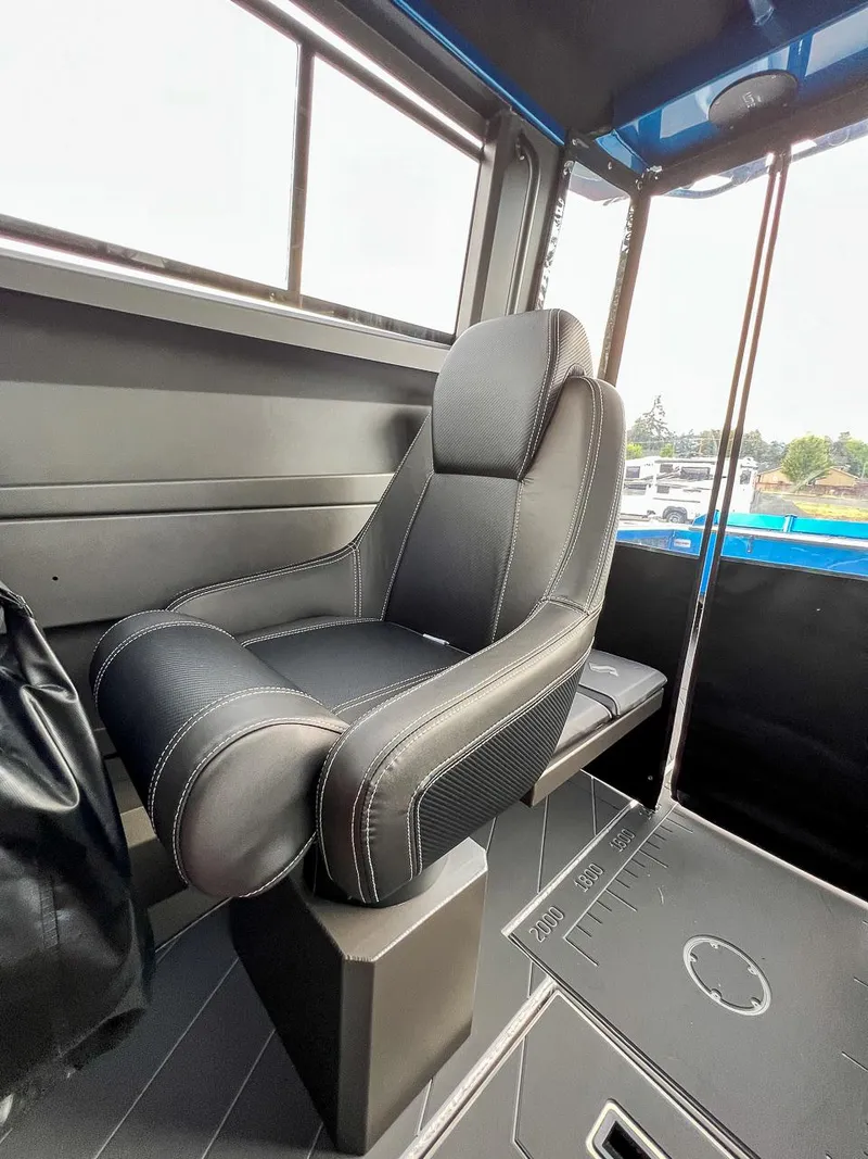 Slide: The Image of Stabicraft 2250 Ultra Centercab 2025 interior with a comfortable captain's chair. - 10