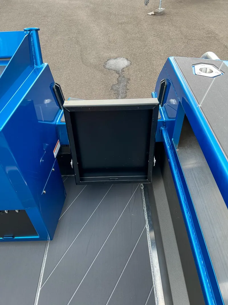 Slide: The Image of Stabicraft 2250 Ultra Centercab 2025 model, blue deck and storage compartment. - 20