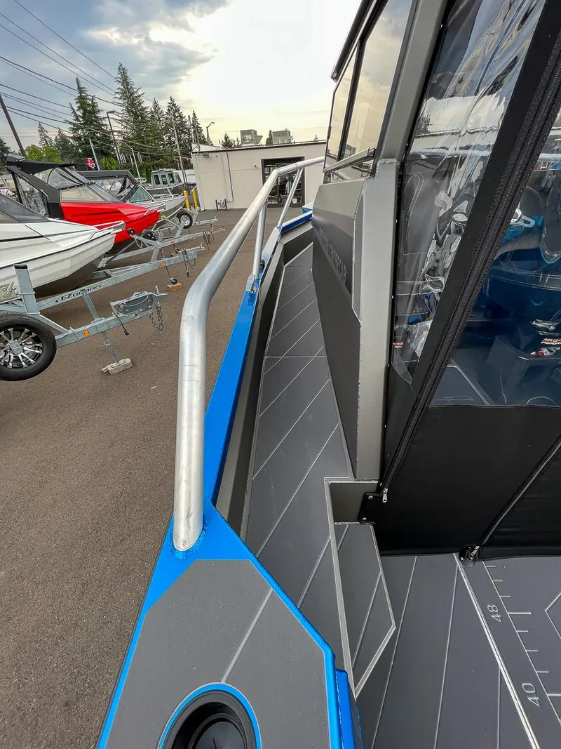 Slide: The Image of 2025 Stabicraft 2250 Ultra Centercab boat on display at a dealership. - 21