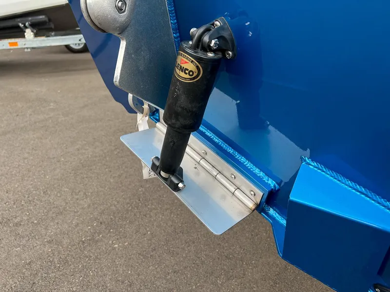Slide: The Image of Close-up of a 2025 Stabicraft 2250 Ultra Centercab boat's trim tab and actuator. - 25