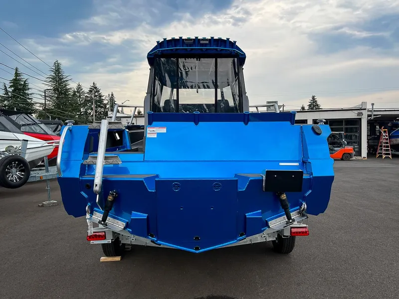 Slide: The Image of 2025 Stabicraft 2250 Ultra Centercab boat, rear view, blue color, parked outdoors. - 4