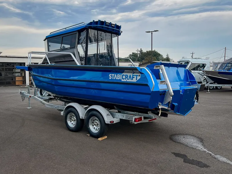 Slide: The Image of 2025 Stabicraft 2250 Ultra Centercab boat on a trailer in a parking lot. - 5