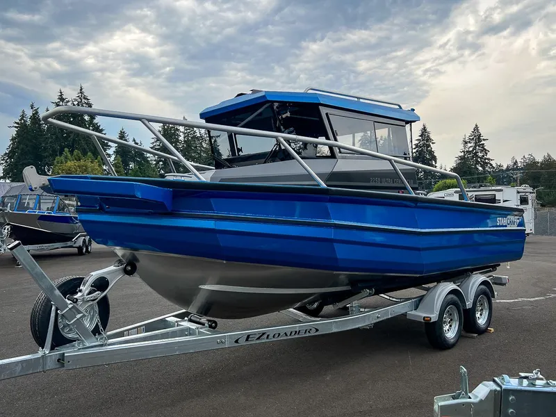 Slide: The Image of 2025 Stabicraft 2250 Ultra Centercab boat on EZ Loader trailer in parking lot. - 6