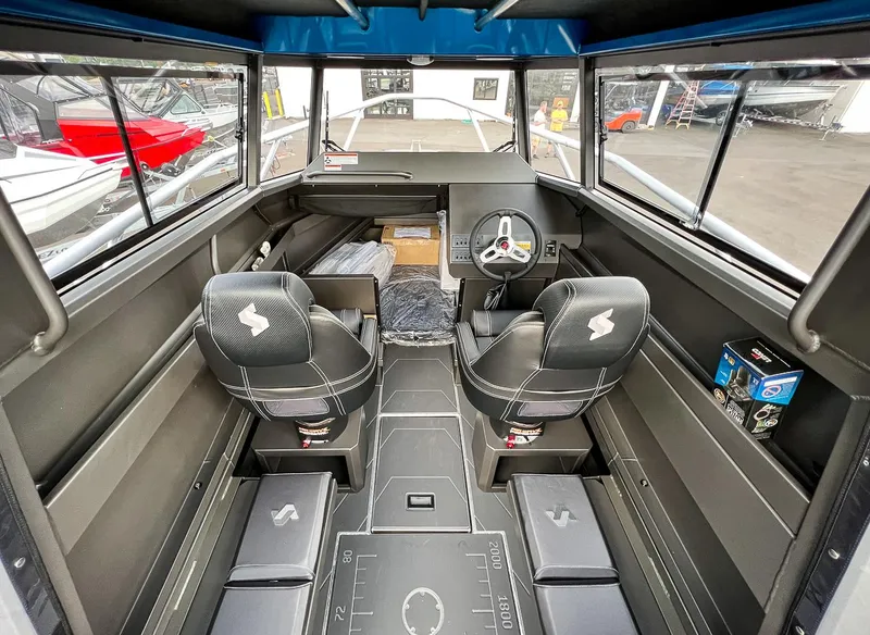 Slide: The Image of Interior of 2025 Stabicraft 2250 Ultra Centercab boat with dual seats and steering console. - 8