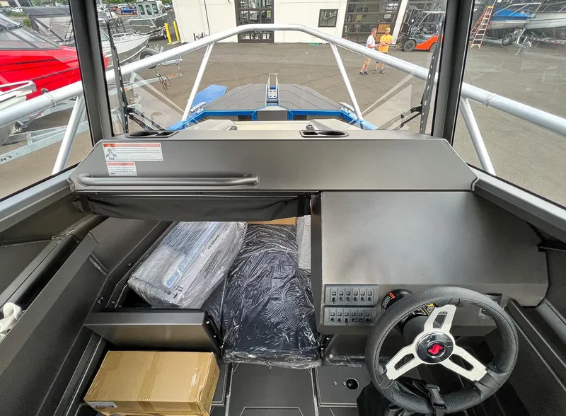 Slide: The Image of Interior view of 2025 Stabicraft 2250 Ultra Centercab boat cockpit and helm. - 9