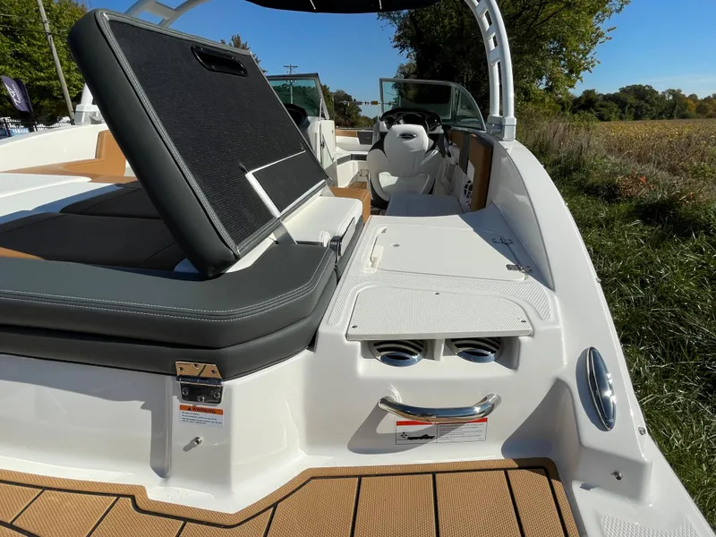 Slide: The Image of 2024 Chaparral 23 SSi OB boat interior with seating and storage compartments. - 46