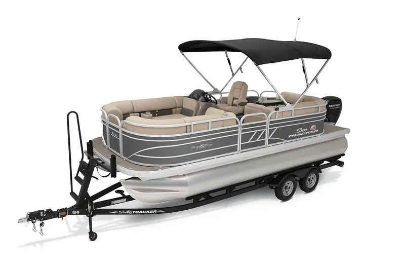Slide: The Image of 2023 Sun Tracker Party Barge 20 DLX interior with beige seating and helm. - 5