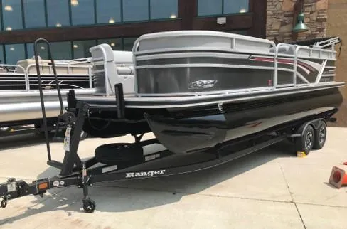 Slide: The Image of 2023 Ranger Reata 220C pontoon boat on a trailer. - 4