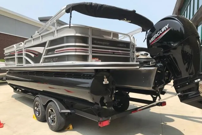 Slide: The Image of 2023 Ranger Reata 220C pontoon boat with Mercury outboard engine on trailer. - 5