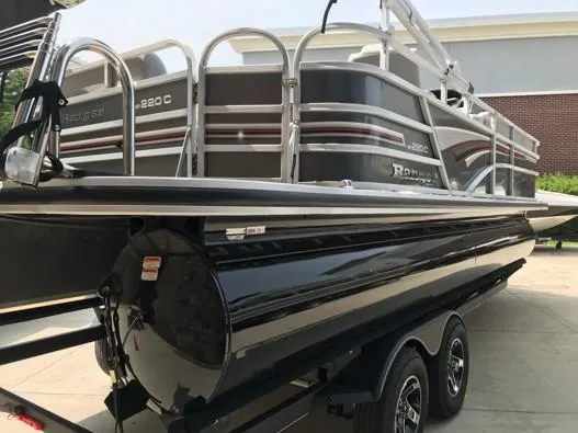 Slide: The Image of 2023 Ranger Reata 220C pontoon boat on a trailer. - 6