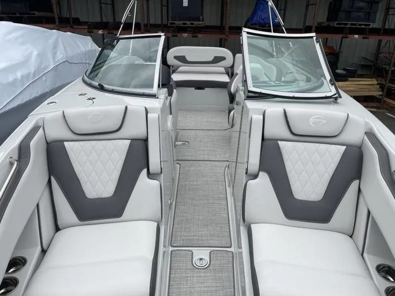 Slide: The Image of 2024 Crownline SS 260 boat interior with white and gray seating. - 11