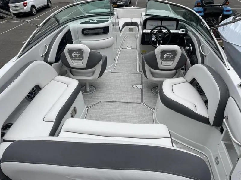Slide: The Image of 2024 Crownline SS 260 boat interior with white and gray seating. - 12