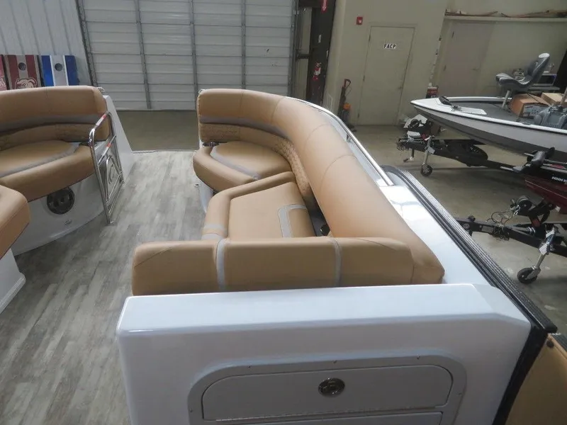 Slide: The Image of 2023 Crest Continental 270 NX SLS Twin boat interior with tan seating. - 16
