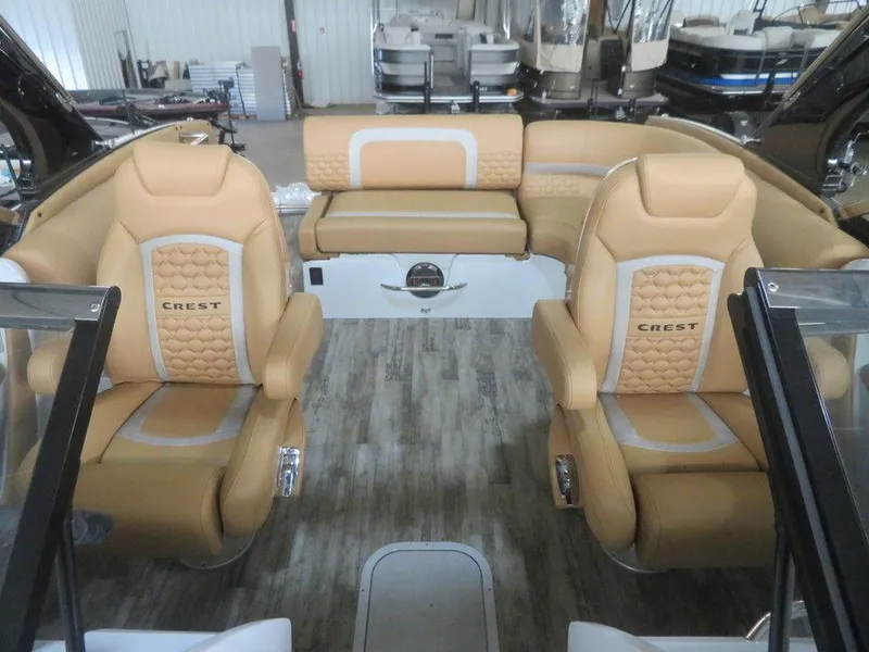 Slide: The Image of 2023 Crest Continental 270 NX SLS Twin boat interior with tan leather seats. - 18