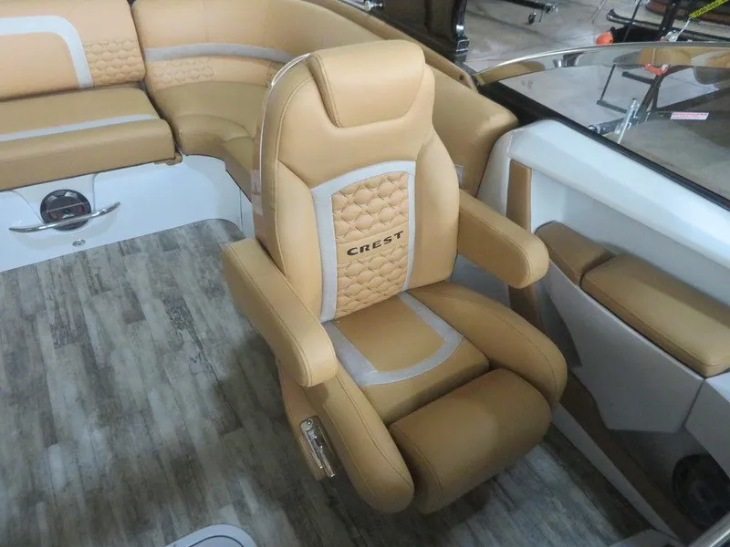 Slide: The Image of 2023 Crest Continental 270 NX SLS Twin boat with luxurious tan seating. - 19