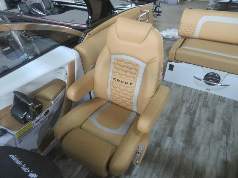 Slide: The Image of 2023 Crest Continental 270 NX SLS Twin boat interior with luxurious captain's chair. - 20