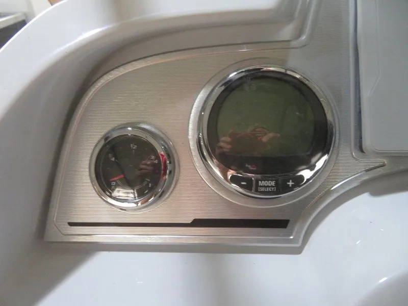 Slide: The Image of Dashboard of 2023 Crest Continental 270 NX SLS Twin boat with gauges and controls. - 25