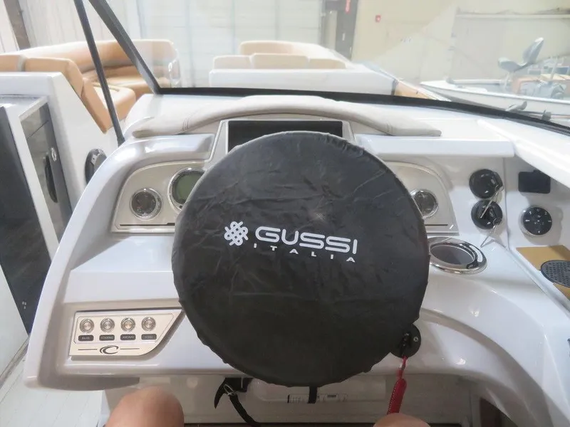 Slide: The Image of 2023 Crest Continental 270 NX SLS Twin boat dashboard with Gussi Italia steering wheel cover. - 29