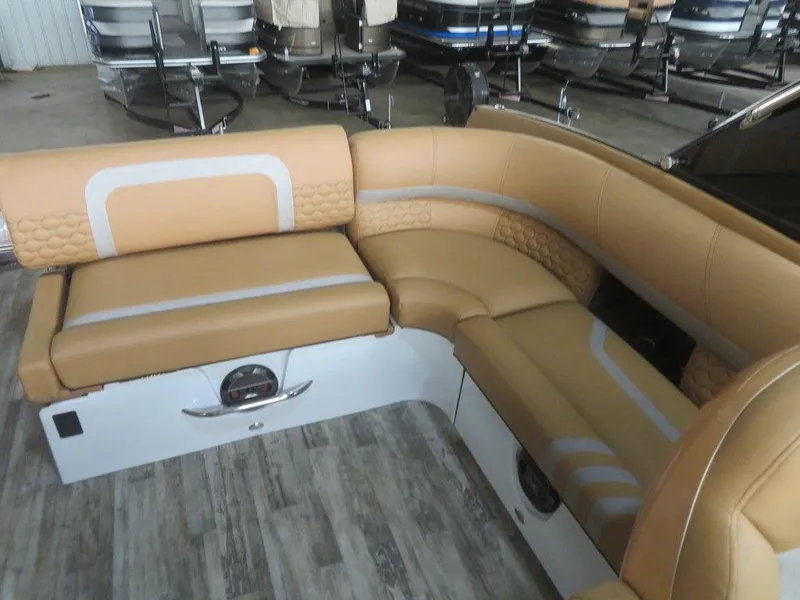 Slide: The Image of 2023 Crest Continental 270 NX SLS Twin boat interior with tan and white seating. - 34