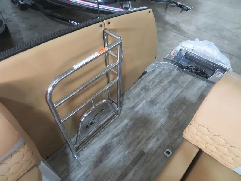 Slide: The Image of 2023 Crest Continental 270 NX SLS Twin boat interior with tan seating and metal railing. - 38