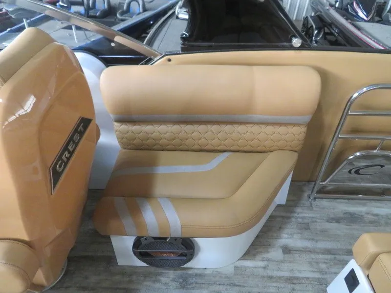Slide: The Image of 2023 Crest Continental 270 NX SLS Twin boat interior seating with tan upholstery. - 39