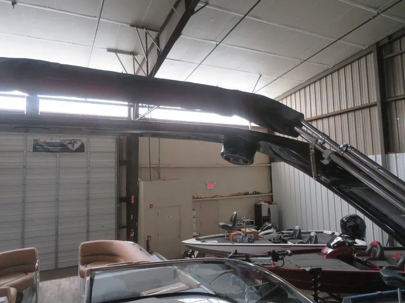 Slide: The Image of 2023 Crest Continental 270 NX SLS Twin pontoon boat in storage facility. - 40