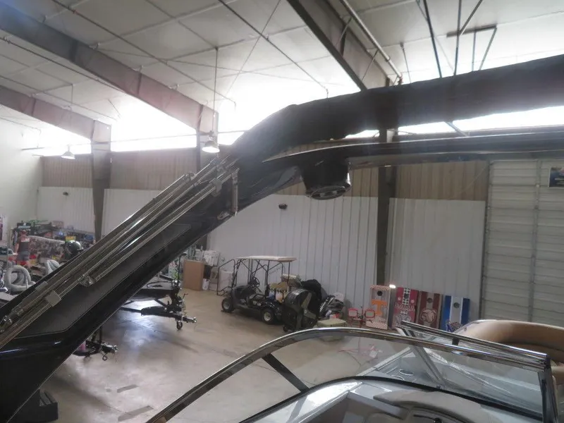 Slide: The Image of 2023 Crest Continental 270 NX SLS Twin boat in a storage facility. - 41