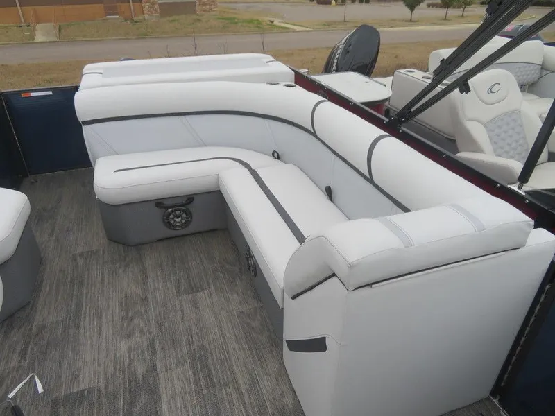 Slide: The Image of 2023 Crest Classic LX 220 L CPT DLX pontoon boat interior with white seating. - 12