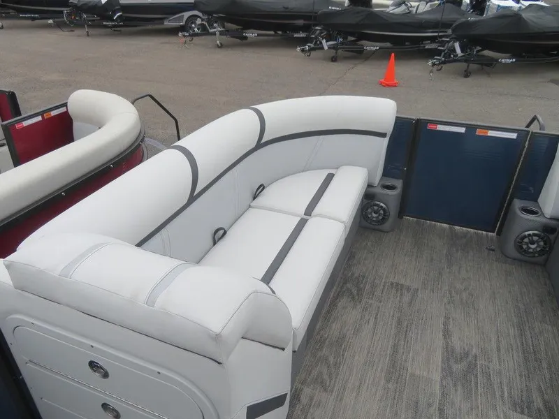 Slide: The Image of 2023 Crest Classic LX 220 L CPT DLX pontoon boat interior with white seating. - 13