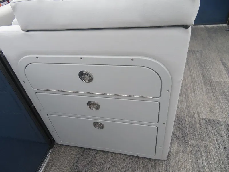 Slide: The Image of 2023 Crest Classic LX 220 L CPT DLX boat storage compartments. - 14