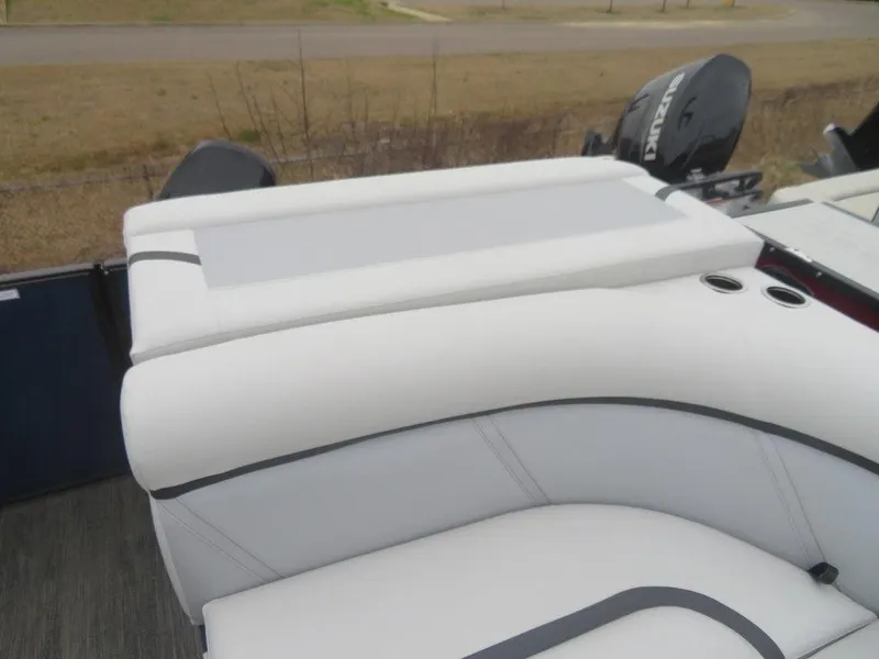 Slide: The Image of 2023 Crest Classic LX 220 L CPT DLX boat with white cushioned seating and outboard motor. - 18