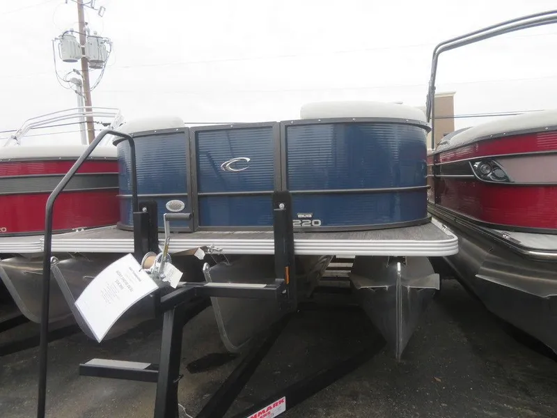 Slide: The Image of 2023 Crest Classic LX 220 L CPT DLX pontoon boat in blue, front view. - 4