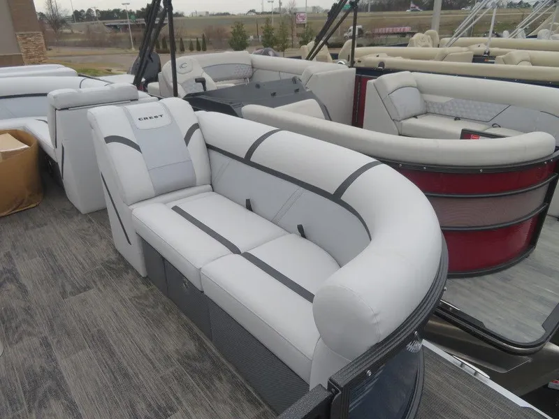 Slide: The Image of 2023 Crest Classic LX 220 L CPT DLX pontoon boat with luxurious seating. - 6