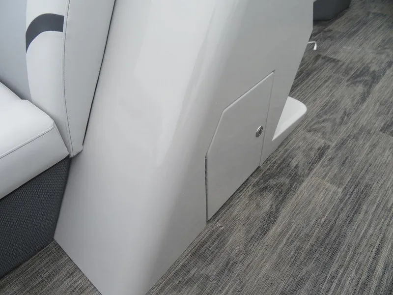 Slide: The Image of 2023 Crest Classic LX 220 L CPT DLX interior detail with storage compartment. - 7