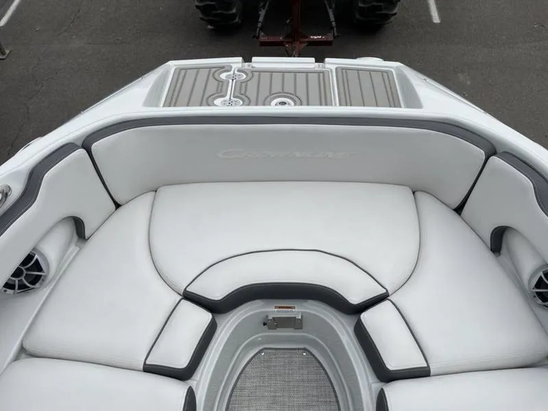 Slide: The Image of 2024 Crownline Eclipse E 255 boat interior with white cushioned seating. - 10