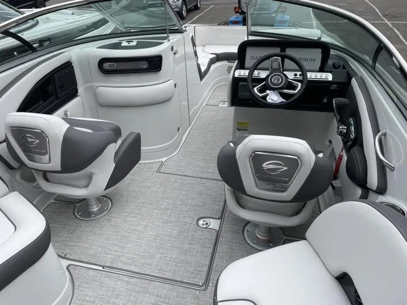 Slide: The Image of 2024 Crownline Eclipse E 255 boat interior with modern seating and steering console. - 6
