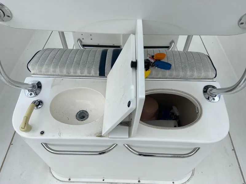 Slide: The Image of Stamas 290 Tarpon 2000 boat console with sink and storage compartment. - 15