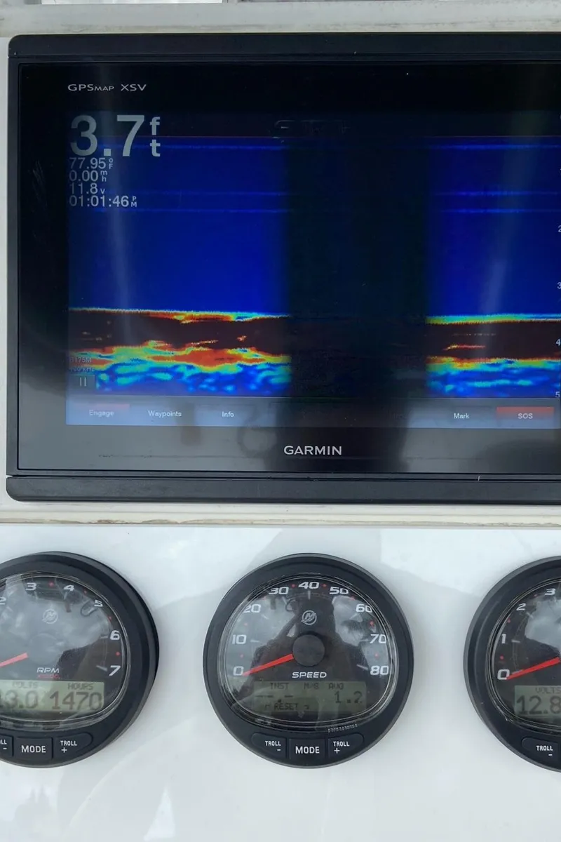 Slide: The Image of Garmin GPS display and gauges on 2000 Stamas 290 Tarpon boat. - 18