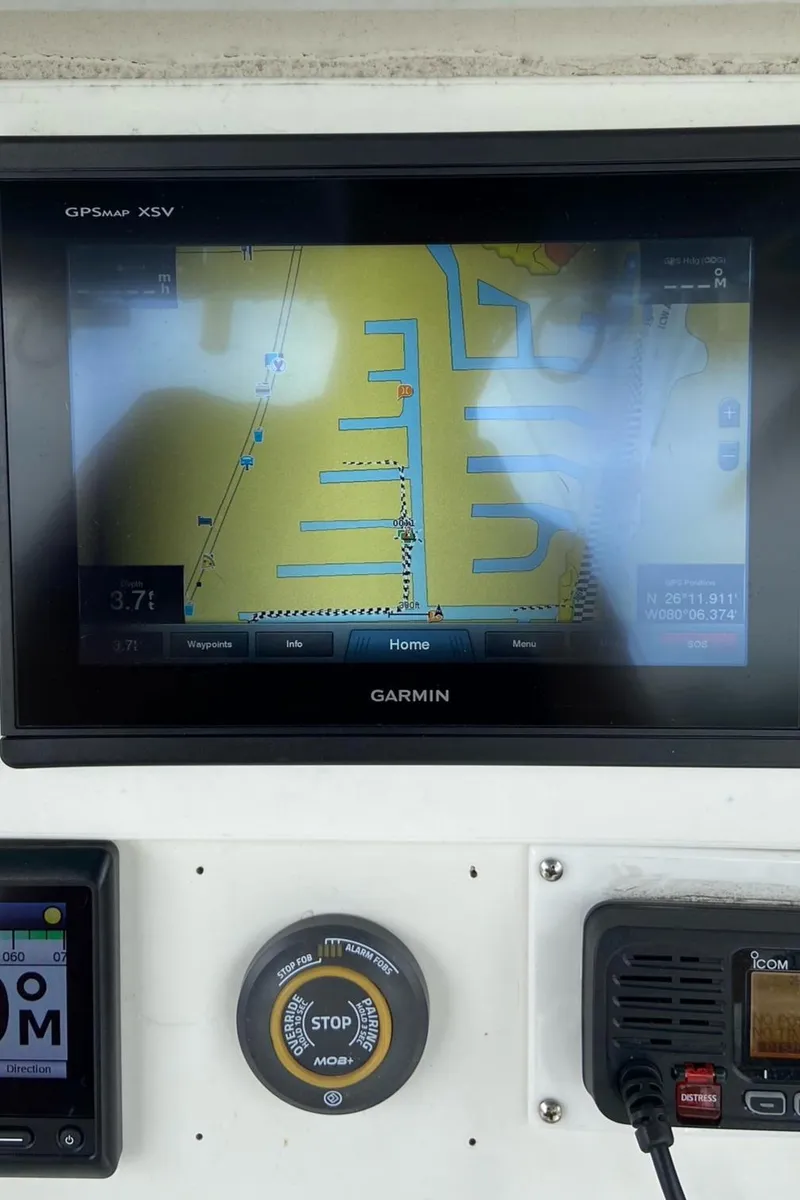 Slide: The Image of Garmin GPS display on 2000 Stamas 290 Tarpon boat dashboard. - 19