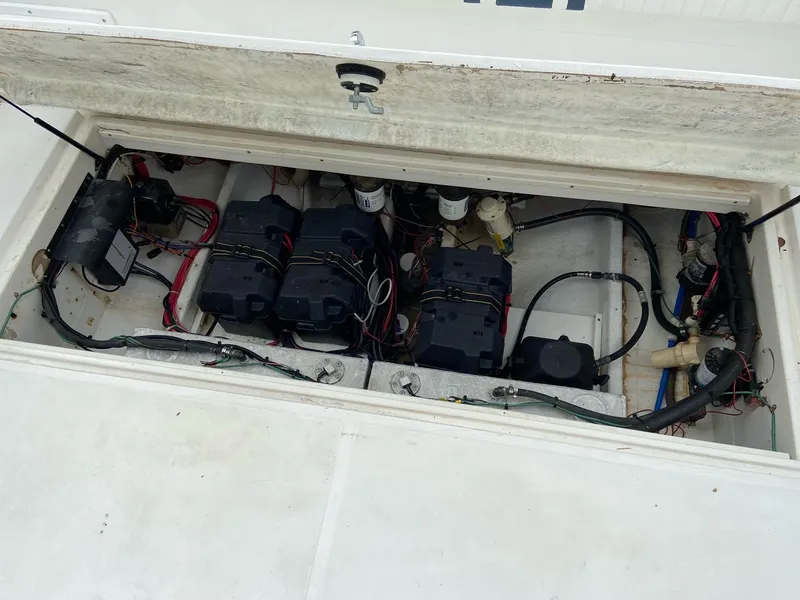 Slide: The Image of Open battery compartment of a 2000 Stamas 290 Tarpon boat. - 25