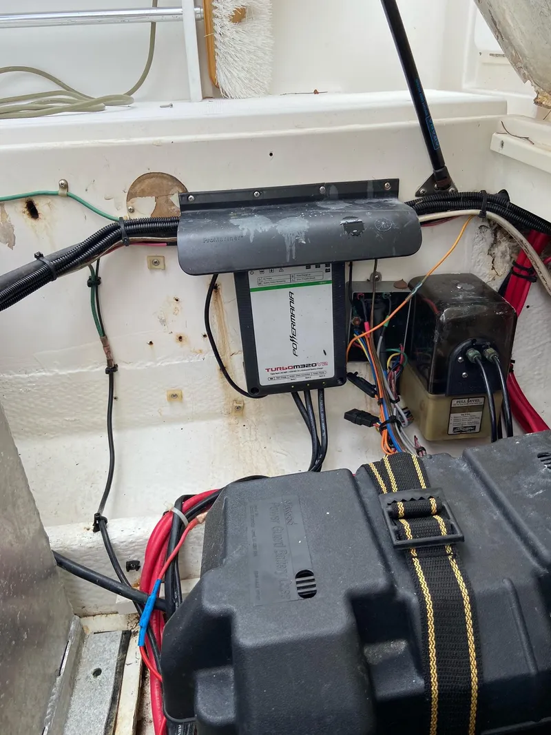 Slide: The Image of Electrical system and battery compartment of a 2000 Stamas 290 Tarpon boat. - 26