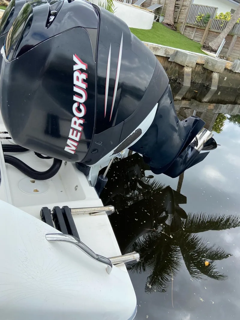 Slide: The Image of 2000 Stamas 290 Tarpon with Mercury outboard motor in water. - 29