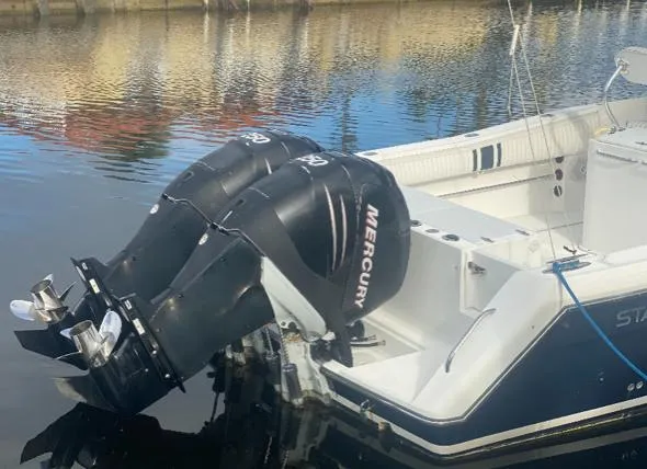 Slide: The Image of 2000 Stamas 290 Tarpon boat with twin Mercury outboard engines. - 3