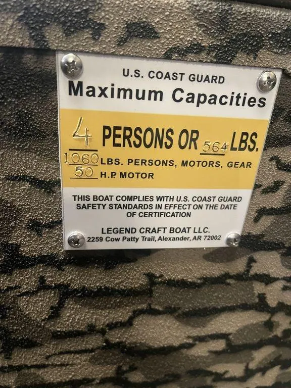 Slide: The Image of 2023 Legend Craft Outlaw 1656 boat capacity label, 4 persons or 564 lbs, 50 HP motor. - 11